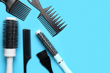Fototapeta na wymiar Hairdresser's brushes on blue background