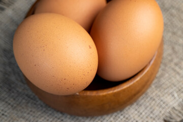 A whole orange chicken egg close-up on the table