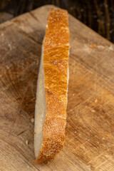 A cut loaf of round-shaped wheat bread