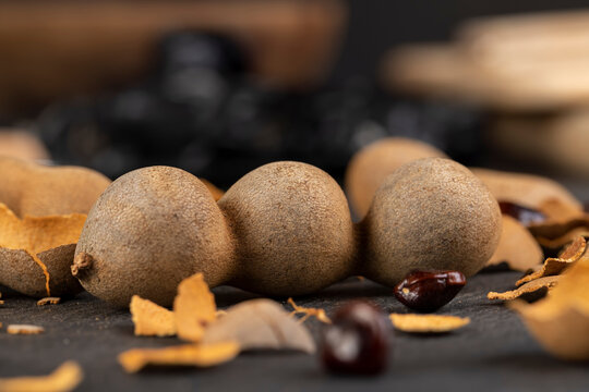 long ripe tamarind pods close up