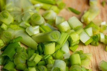sliced washed green onions on a board