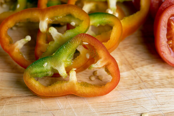 Fresh ripe bell pepper sliced on a board