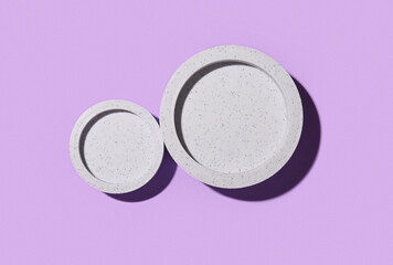 Decorative plaster podiums on lilac background