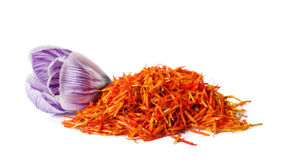 Heap of dried saffron threads and crocus flower isolated on white background