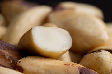 Fresh Brazil nuts peeled from the shell on the table