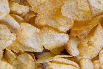 thin potato chips with spices, close up