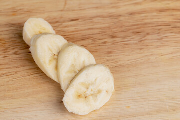 a ripe sweet banana cut into pieces lies on the table