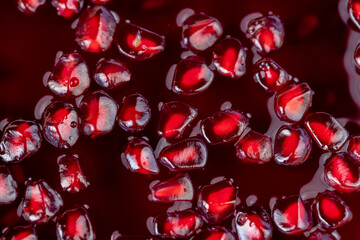 peeled red ripe pomegranate with red sweet grains