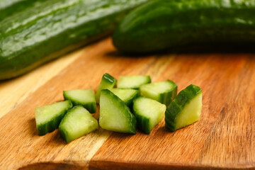 Pieces of fresh cucumber on table, closeup