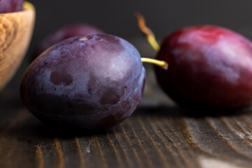 Ripe delicious plums of dark color