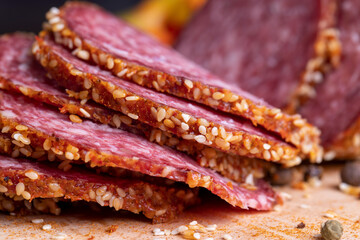Sliced beef sausage with spices and lots of sesame seeds