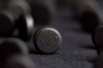 Open and unpacked tablets of black color close-up