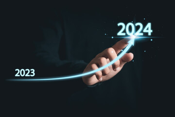 Businessman analyzing economic trend data for long-term investment. New year business goals 2024...