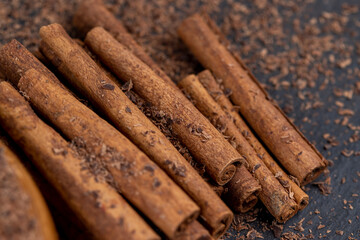 solid aromatic cinnamon on the table in chocolate