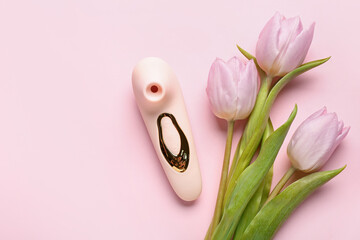 Vibrator with tulips on pink background - obrazy, fototapety, plakaty