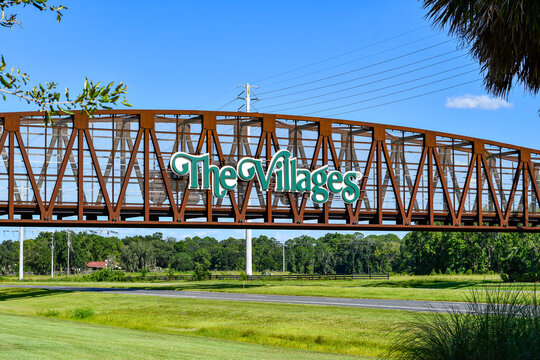 Steel Bridge For Golf Carts With The Villages Sign Near A  Planned Retirement Community In Central Florida