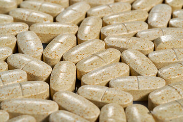 multivitamins scattered on the countertop, take as prescribed by the doctor