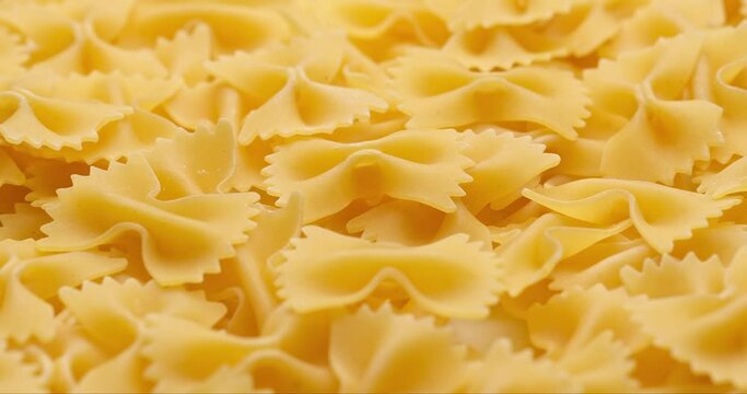 pasta backgroud - macro view of Dry Authentic Italian farfalle