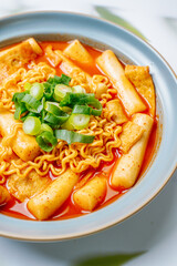 Rabokki, Korean style Stir-fried Instant Noodle : This dish is tteokbokki with ramen noodles. Tteokbokki is a spicy dish made with rice cake, vegetables, and fish cake, all stir-fried together in a go