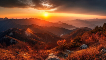 Majestic mountain range, tranquil meadow at dusk generated by AI