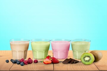 Tasty sweet fruits smoothie in glasses on the desk