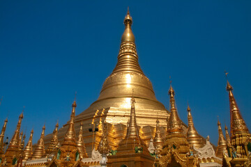 Fototapeta premium Golden big pagoda is surrounded by small pagodas in Shwedagon Pagoda Yangon, Myanmar