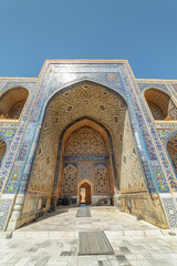 Fototapeta na wymiar Colorful arched niches at courtyard of the Ulugh Beg Madrasah
