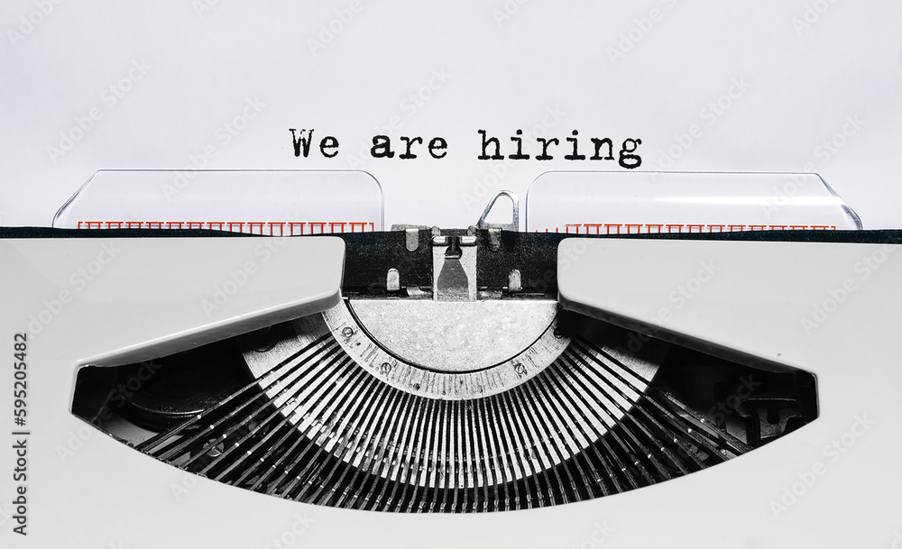 Poster text we are hiring typed on retro typewriter