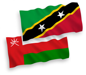 Flags of Federation of Saint Christopher and Nevis and Sultanate of Oman on a white background