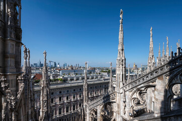 Rooftop of Duomo di Milano or Milan Cathedral with spires and statues