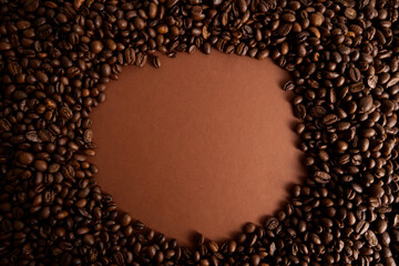 Roasted coffee beans closeup and round blank space for text