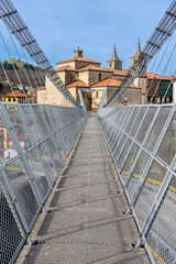 Obraz premium Suspension bridge, for the passage of people, and cross the Narcea river in Cangas del Narcea, Asturias, Spain