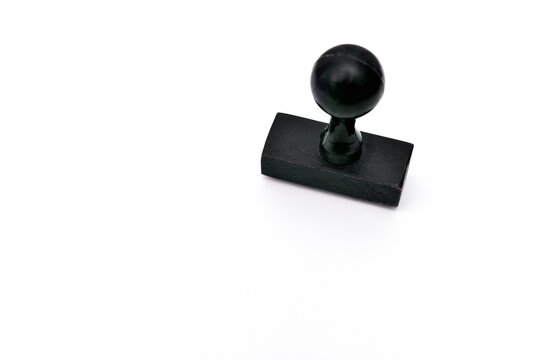 Black wooden rubber stamp with the copy space on the white paper