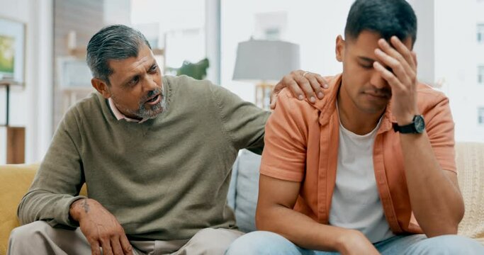 Depression, support or empathy with a father and son talking in the living room to comfort, console or care. Family, love and help with a senior man helping an adult child through pain, grief or loss
