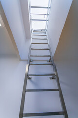 Stainless steel ladder installed at the entrance to the roof.