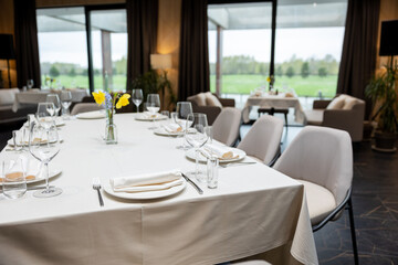 Served dinner table in a restaurant. Restaurant interior