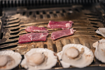 grilled meat and seafood  on a grill
