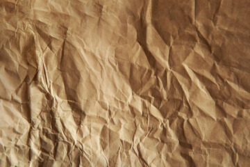 Craft creased or messy light brown color recycled blank paper texture background with space