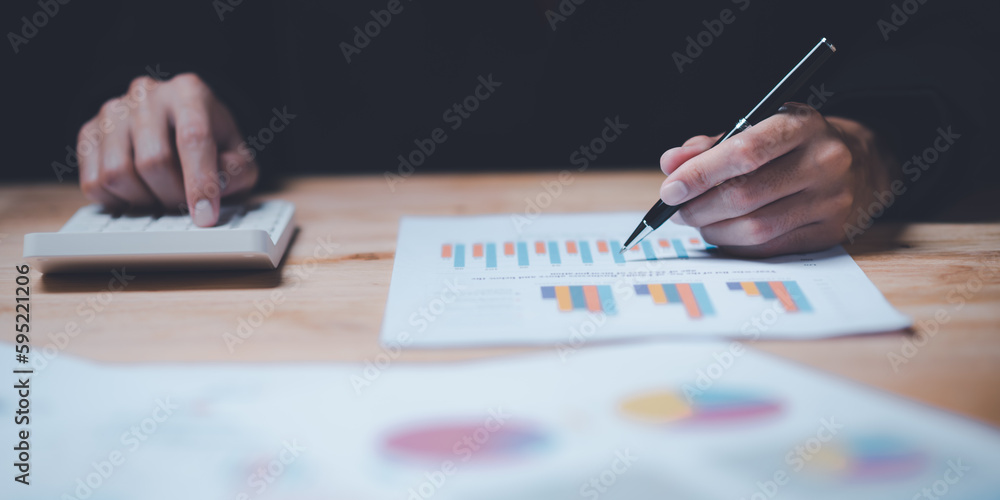 Poster businessman reading graph report and business statistics charts ,analysis and improvement of corpora
