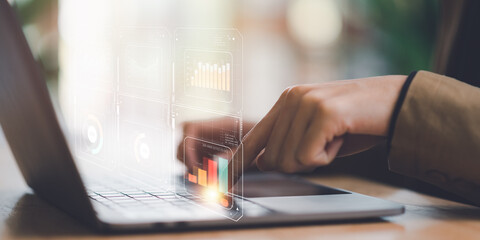 Businessman reading graph report and business statistics charts ,Analysis and improvement of corporate strategy ,Statistics and Data Concepts ,update annual budget accounts , business growth graph