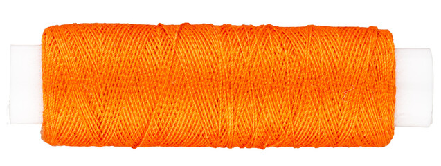 Spool with orange thread for sewing, supply for sewing, isolated object 
