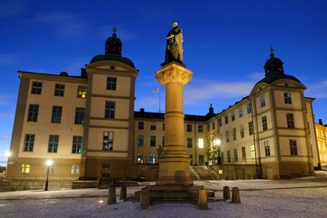 Fototapeta na wymiar Illuminated Stockholm by night. Wrangelska palatset (Court of Appeal of Svealand), townhouse mansion with Stenbock Palace, Riddarholmen islet, Gamla Stan