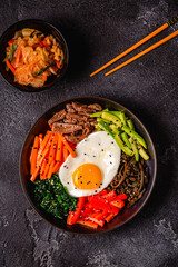 Traditional Korean dish Bibimbap: rice with vegetables beef and egg.