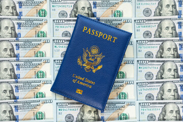 US passports in a pile of US dollar banknotes. US document. an American passport against the background of a large pile of American dollars. The concept of lending or buying fake documents. - obrazy, fototapety, plakaty