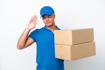 Delivery caucasian man isolated on white background making stop gesture and disappointed
