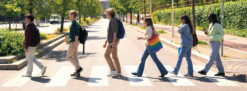 Young Group Of Students Going To College Class, Walking On The Street At The City. 