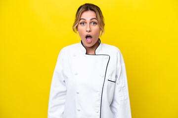 Uruguayan chef woman isolated on yellow background with surprise facial expression