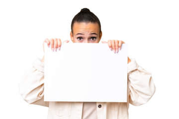 Young Arab woman over isolated background holding an empty placard and hiding behind it