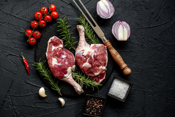 raw duck legs on stone background