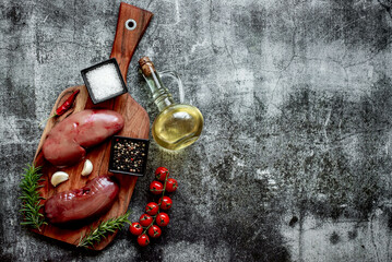 raw pork kidneys on stone background with copy space for your text
